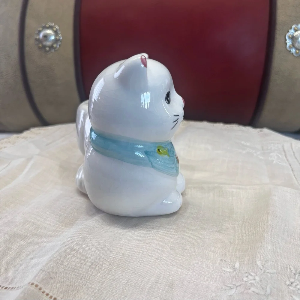 White Ceramic Cat-Shaped Planter with a Blue Scarf Adorned with Fish.